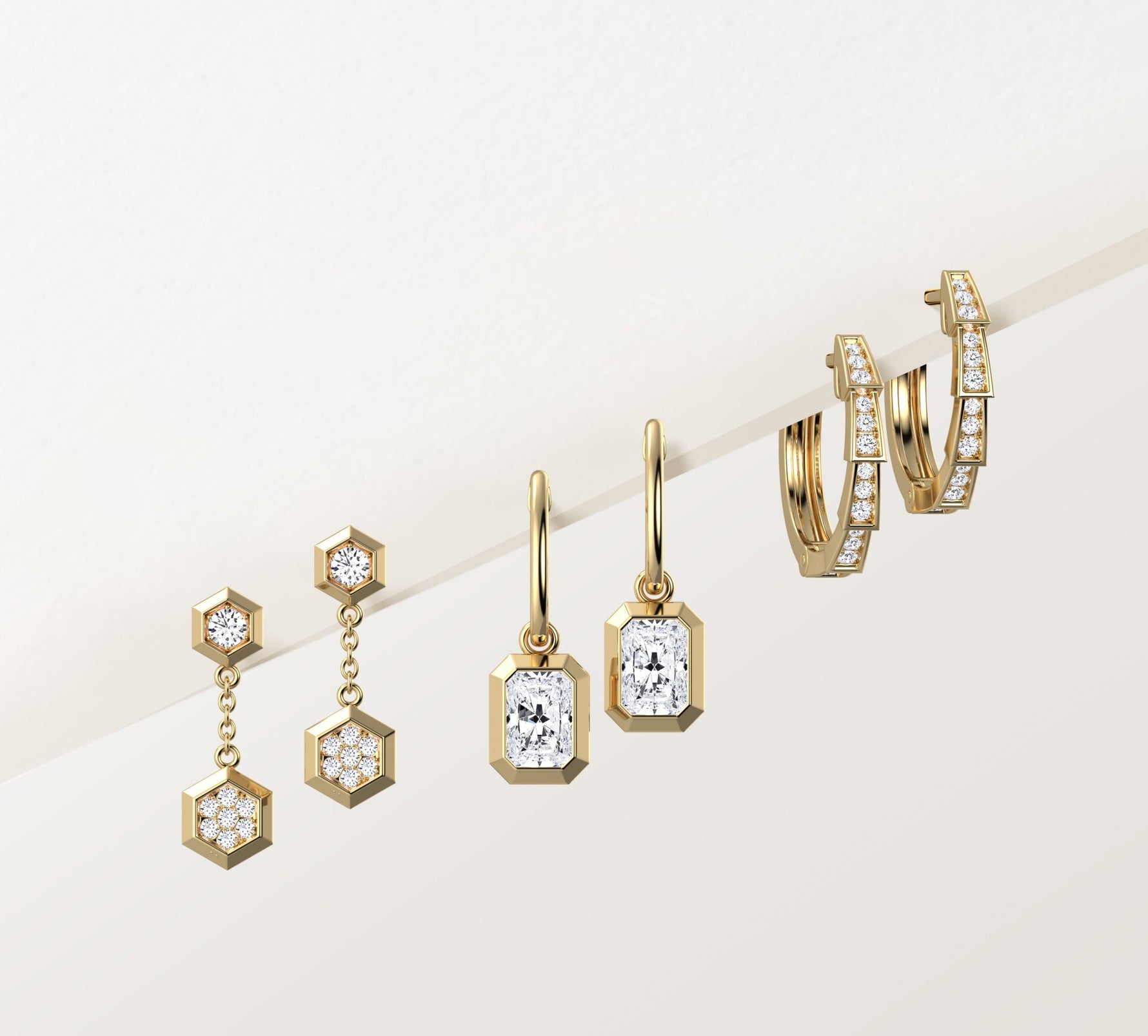 Set of gold earrings including hoop, dangle, and hexagonal designs on a light background