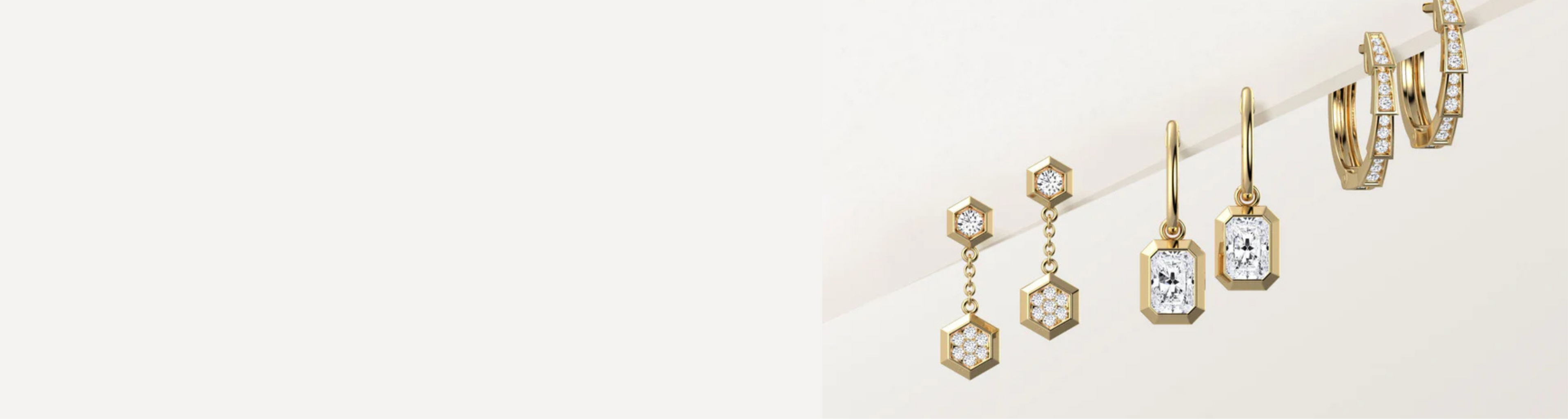 Set of gold earrings on a white background